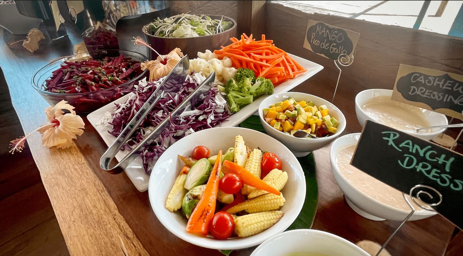 A farm-to-table buffet of fresh salads, vegetables and dressings