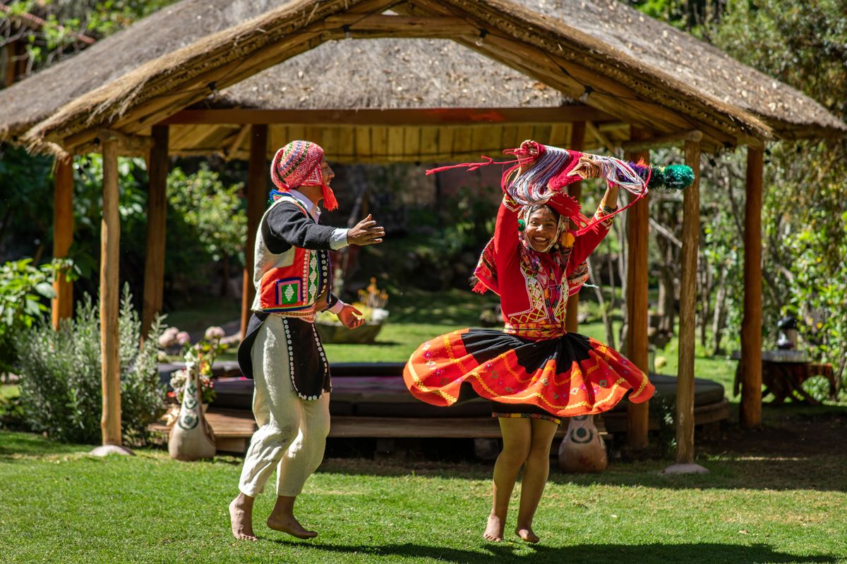 Traditional Andean dancers in the lodge gardens
